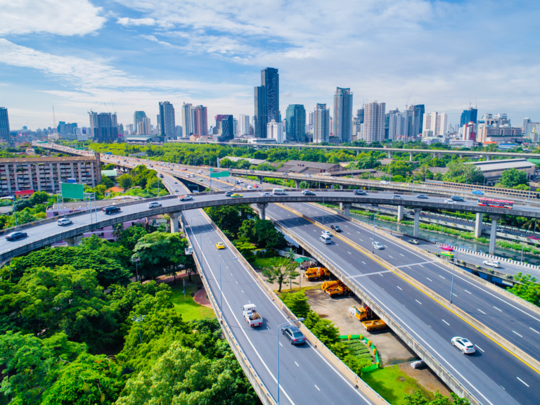 A view of traffic traveling on a highway in Thailand.